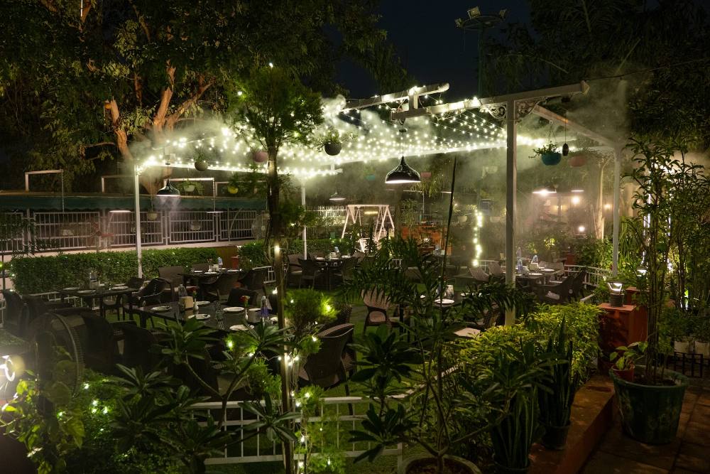 Dining among plants under warm lights