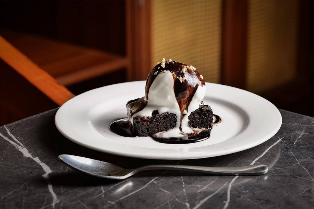 Chocolate dessert served with ice cream