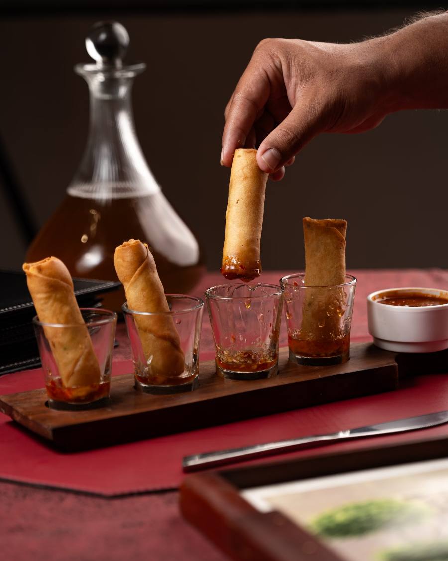 Crisp starters brought over on a wooden board, served while they're still hot.