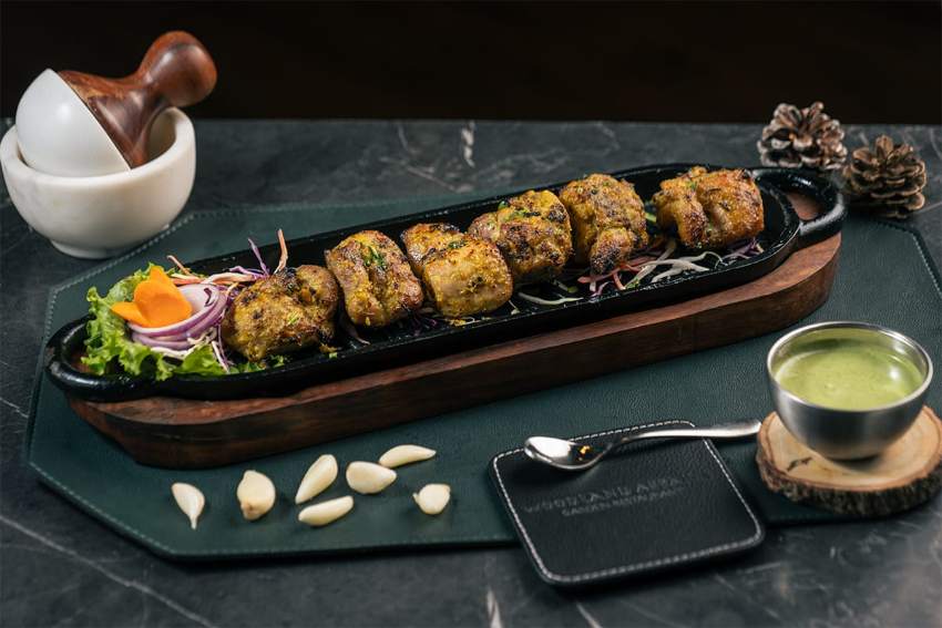 Seekh kebabs served on a board